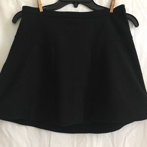 Black pleated/peplum skater skirt